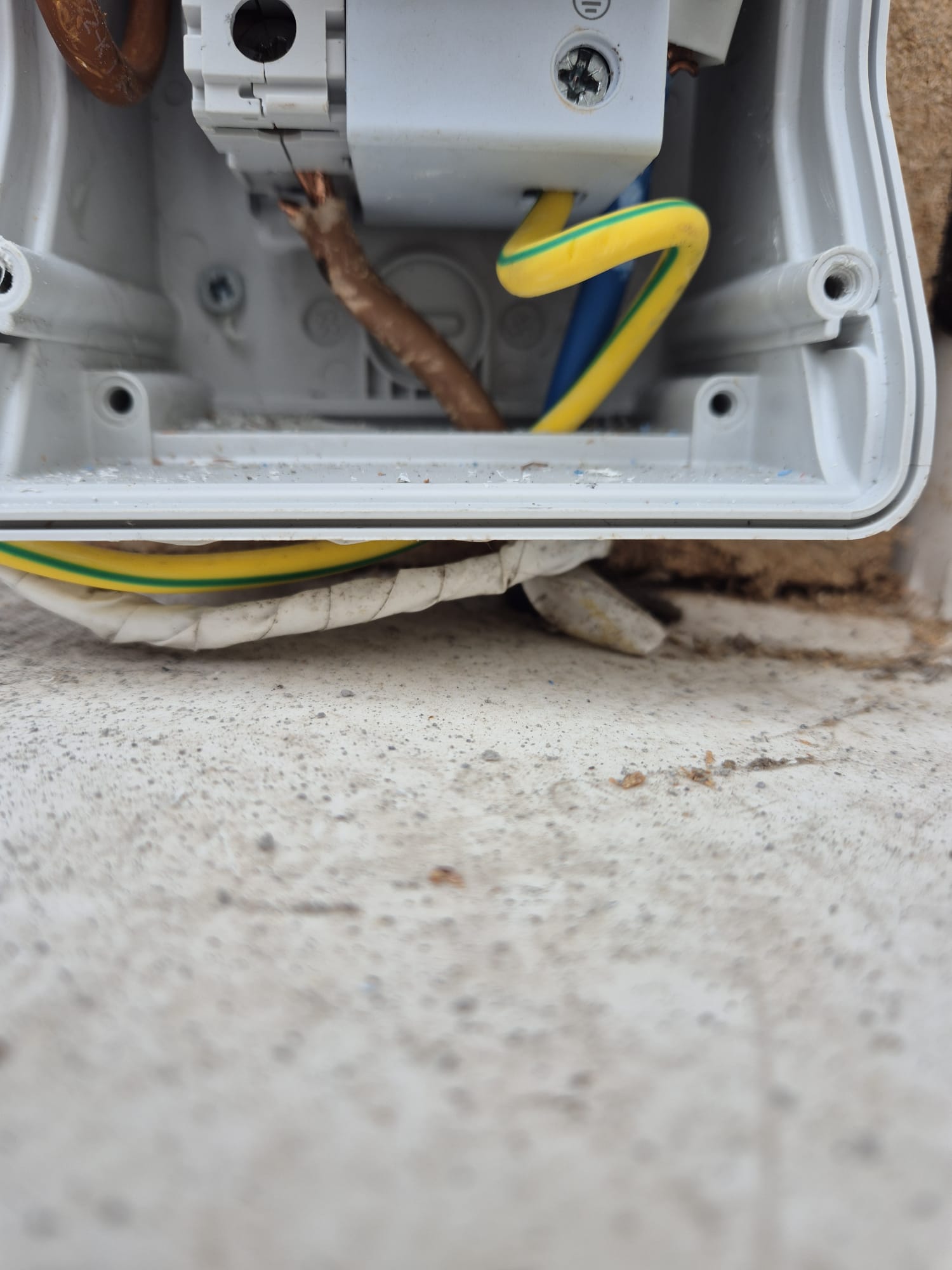 Outdoor enclosure with earth and tails terminated.