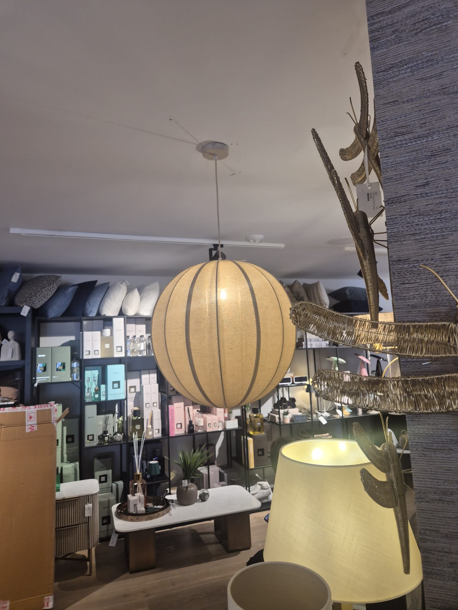 Large fabric globe pendant fitted on a suspended point.
