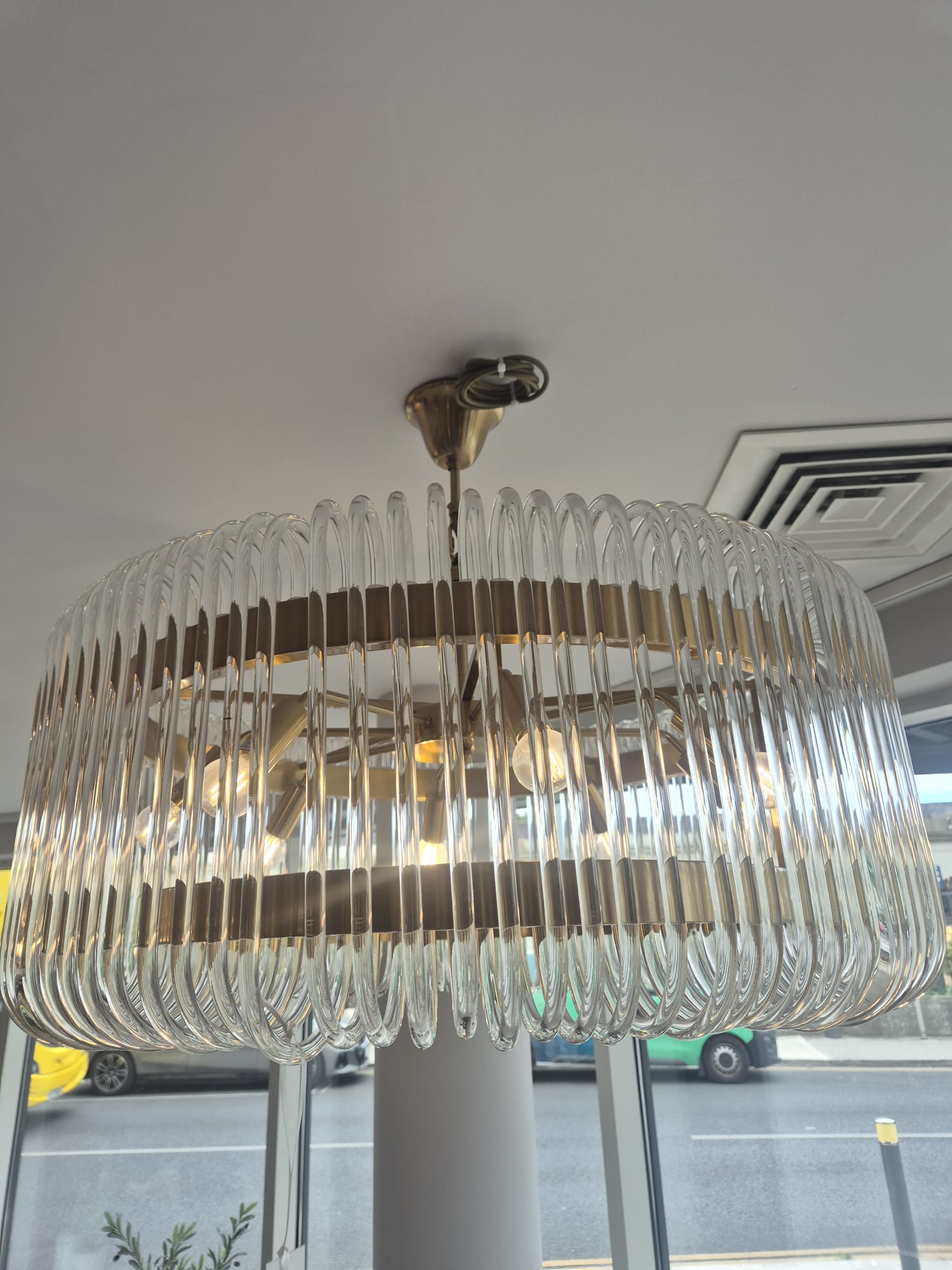 Glass rod drum pendant assembled and wired on site.